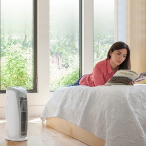 girl in a room with air cleaner